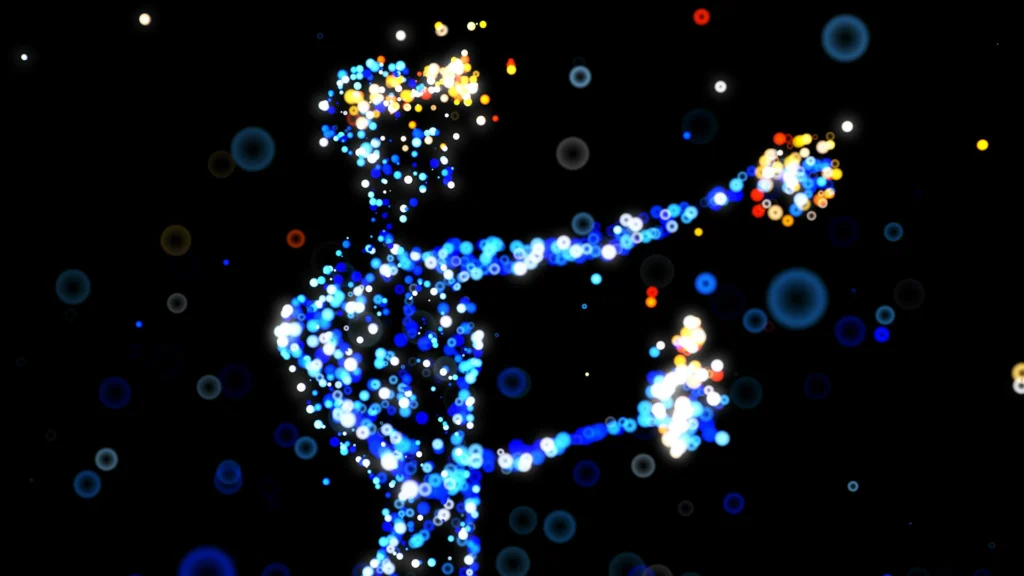 Silhouette humaine composée de particules lumineuses bleues et multicolores sur fond noir.
